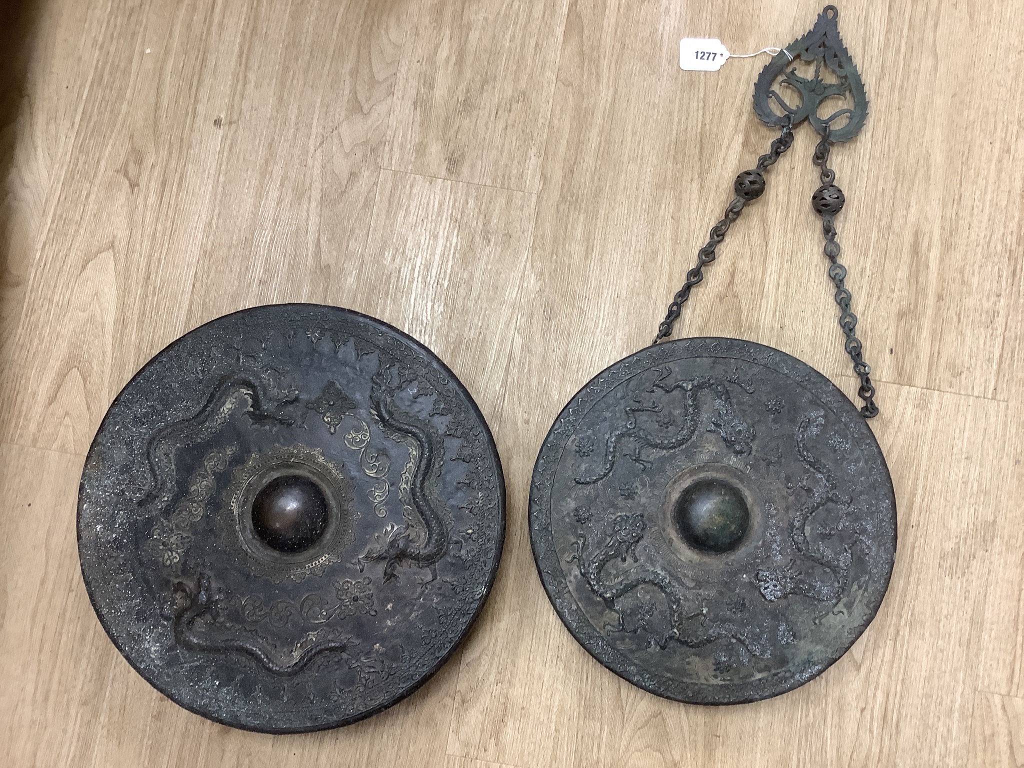 Two 19th century Borneo bronze gongs, Tawak-Tawak, largest 42cm diameter